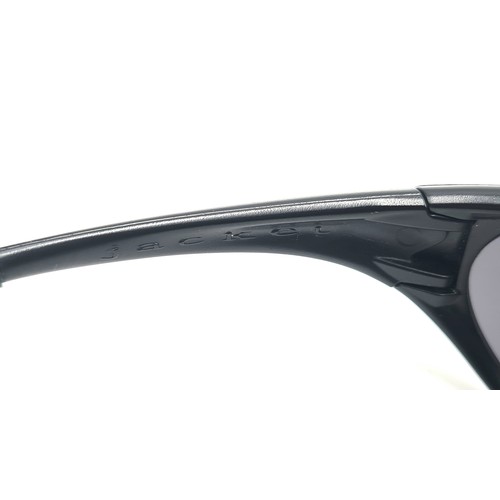 501 - A pair of high quality designer Oakley wrap around gentleman's sunglasses. Lenses in good condition.... 