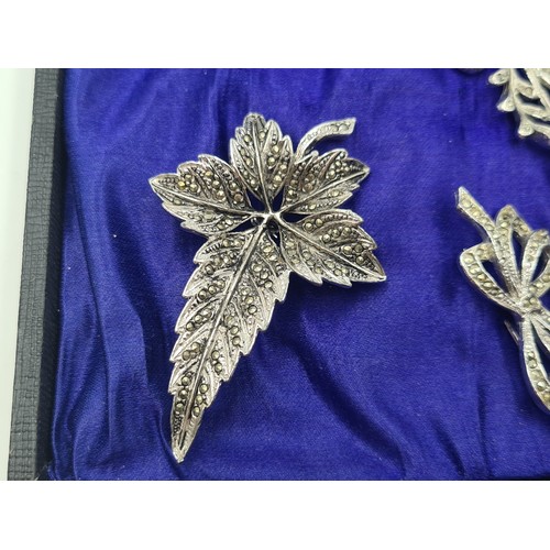 502 - A beautifully presented collection of ten vintage Marcasite brooches, including stunningly crafted f... 