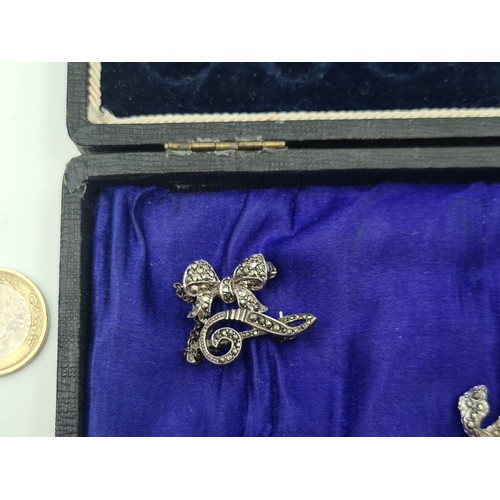 502 - A beautifully presented collection of ten vintage Marcasite brooches, including stunningly crafted f... 