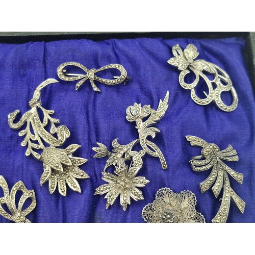 502 - A beautifully presented collection of ten vintage Marcasite brooches, including stunningly crafted f... 