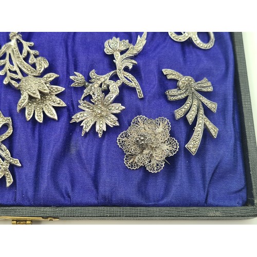 502 - A beautifully presented collection of ten vintage Marcasite brooches, including stunningly crafted f... 