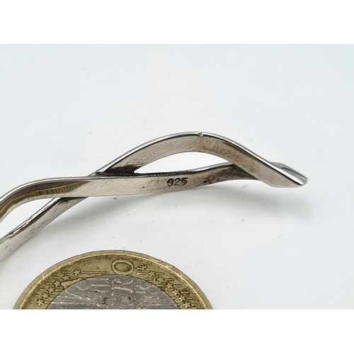 506 - A sterling silver contemporary Celtic inspired twist cuff bracelet. Encased in its original presenta... 