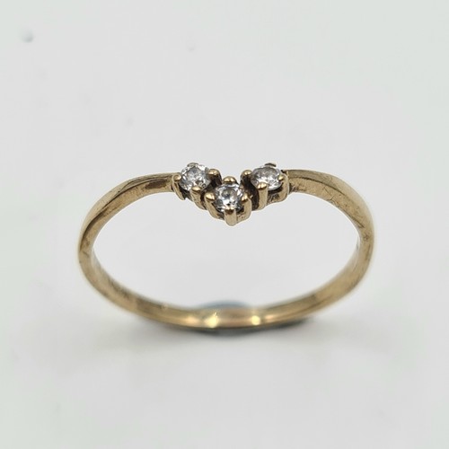 511 - A beautiful 9 carat gold gem set three stone wishbone ring. Ring size: O. Weight: 1 gram. Encased in... 