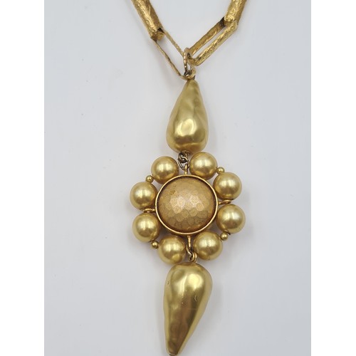 514 - A unusual gilded necklace by the designer Max Mara of Italy, featuring floral and link detail. Weigh... 