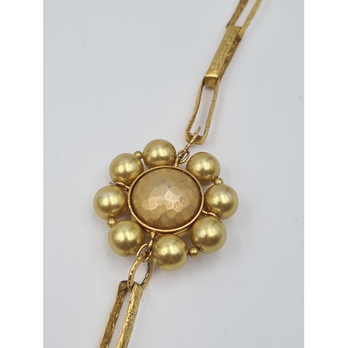 514 - A unusual gilded necklace by the designer Max Mara of Italy, featuring floral and link detail. Weigh... 