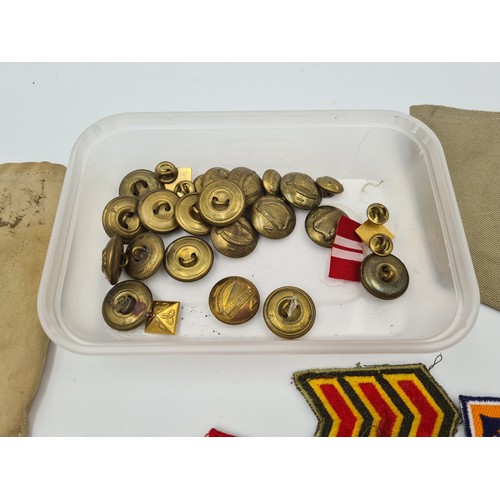 523 - An interesting collection of 20 Irish military tunic buttons together with further Irish military ba... 