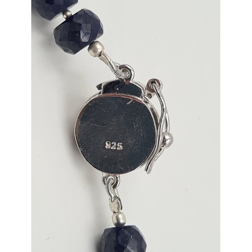 528 - A heavy and generous natural Sapphire stone graduated singe stand necklace, set with a sterling silv... 