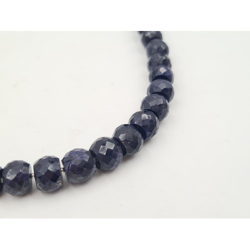 528 - A heavy and generous natural Sapphire stone graduated singe stand necklace, set with a sterling silv... 