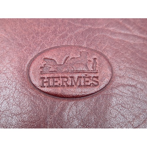 534 - A leather designer wallet by Hermes, featuring a fabulous champagne interior. In good condition.