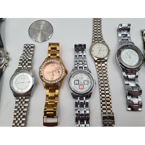 537 - A large collection of nine wrist watches, seven of which have metal bracelets. Together with a Sekon... 