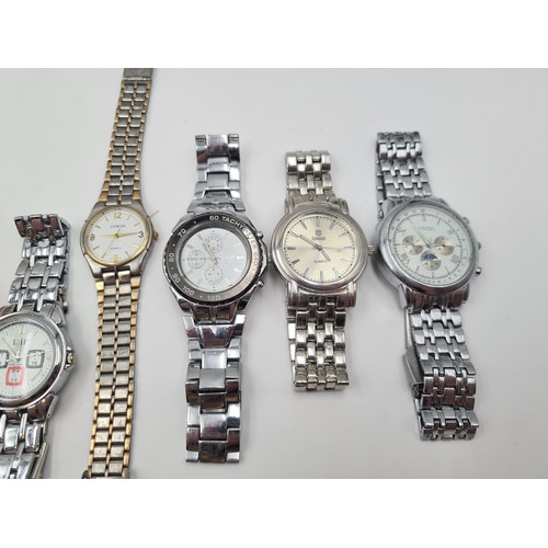 537 - A large collection of nine wrist watches, seven of which have metal bracelets. Together with a Sekon... 