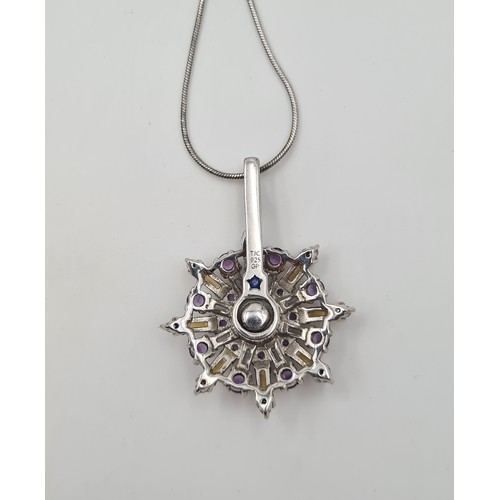 538 - A Gorgeous  articulated circular pendant, set in sterling silver and consisting of Amethyst and Citr... 