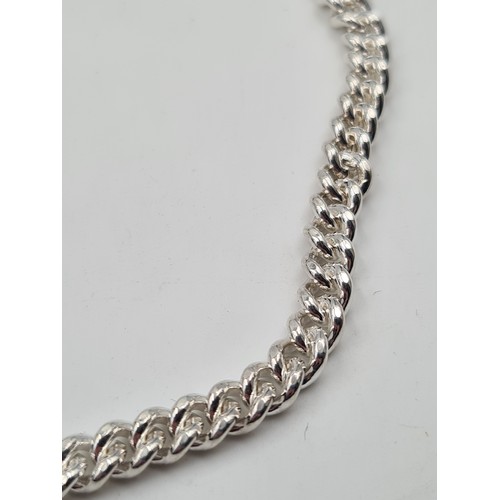 542 - An Irish silver unisex chain, set with lobster clasp. Length of chain: 56cm. Weight: 44.39 grams.