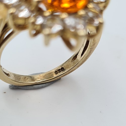 551 - A show stopping and unusual Orange Topaz stone ring, set beautifully with an array of White Sapphire... 