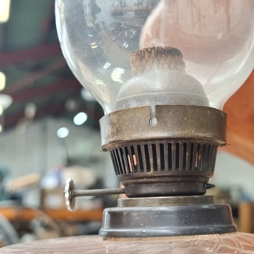 238 - A beautiful vintage oil lamp with an ornate brass base, a delicate pink glass bowl and complete with... 