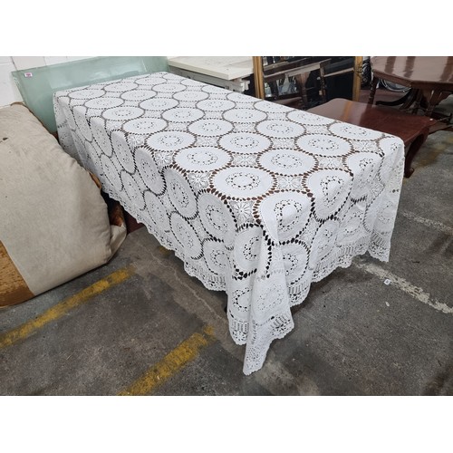 241 - A large vintage  Irish crochet and linen tablecloth featuring beautiful foliate detail. In very good... 