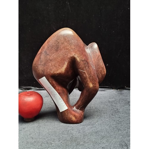 533 - A very heavy large African soapstone sculpture of a stylised Elephant form. Very heavy piece in a da... 