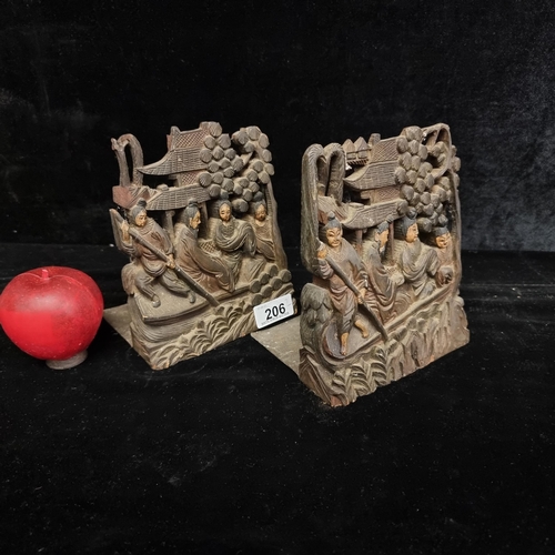 206 - A very unique pair of antique Chinese bookends. Lavishly carved with a traditional scene of elegantl... 