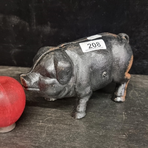 208 - A charming heavy cast metal money bank, in the traditional shape of a piggy!