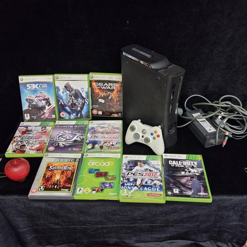 252 - An Xbox 360 console with a controller and a selection of ten Xbox 360 games including 'Assassins's C... 