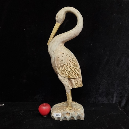 275 - A large tall wooden sculpture depicting a crane. Featuring lovely carved detail and a rustic finish ... 