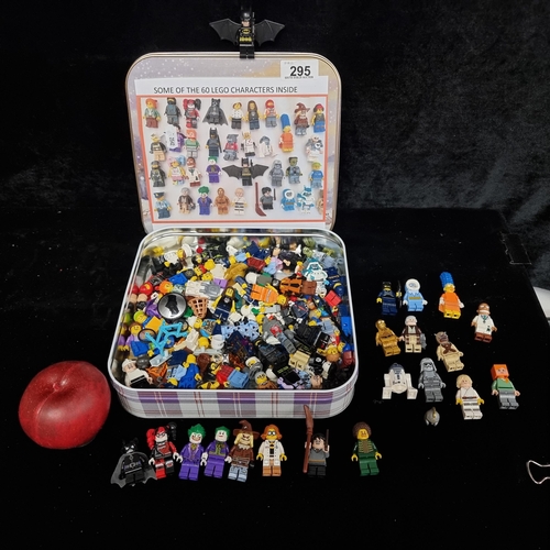 295 - A large tin filled with collectible Lego figurines including examples from Batman, Star Wars, Harry ... 