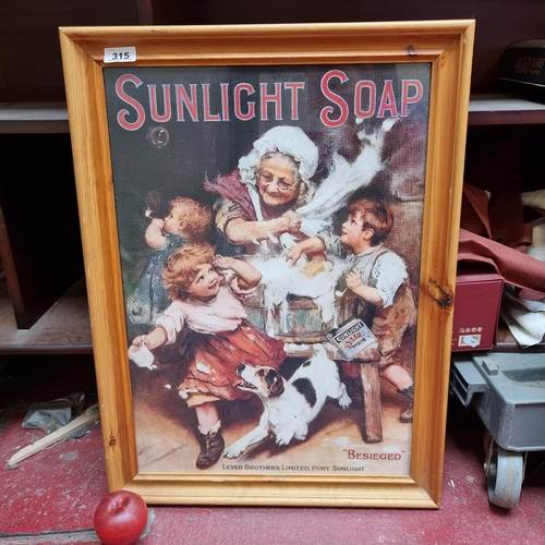 315 - A nicely sized framed print advertising Sunlight Soap in a pine wood frame.