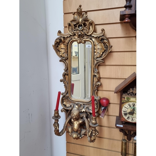 322 - Star Lot - A stunning George II style wall mirror with beveled mirror to centre surrounded by a high... 