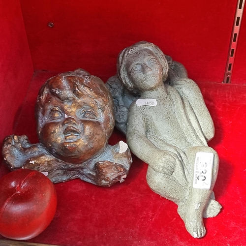 330 - Two wonderful antique sculptures including a charming cherub and another primitive style example wit... 