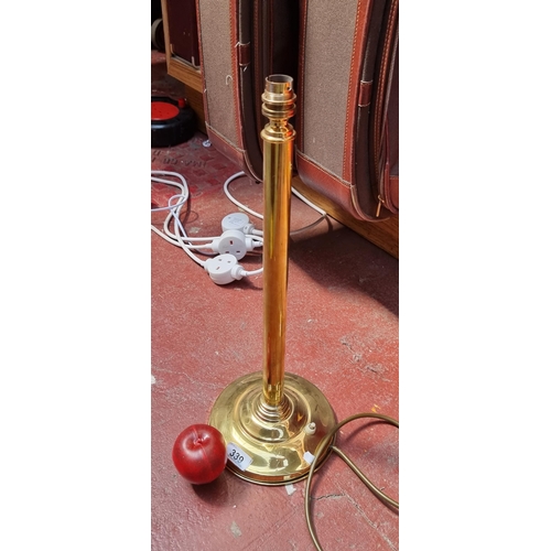 339 - A brilliant and tall vintage heavy brass lamp base. With high polish finish, column stem and heavy r... 