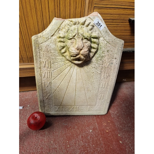 351 - A heavy reconstituted stone wall sun dial plaque with a high relief lion mask and Roman numerals. SD... 