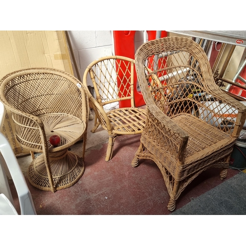 370 - Three beautiful 1960s chairs including a two wicker examples with an elegant rattan tub chair featur... 