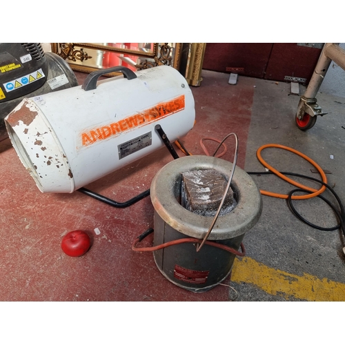 374 - A large portable gas heater from Andrew Sykes, model G60C. With a big barrel set on a metal tubular ... 