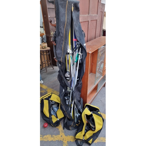 386 - Star Lot - A mixed lot of adult ski-wear. Consisting of two sets of adult alpine skis including one ... 