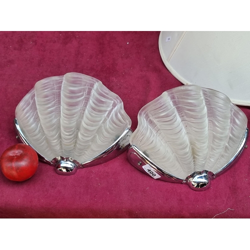 400 - A fabulous pair of glamorous French art deco original wall sconces. These shell shaped examples have... 