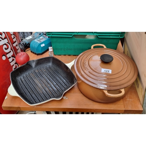 422 - Two very heavy enamel cast iron Le Creuset items including a lidded casserole pot and a griddle pan.