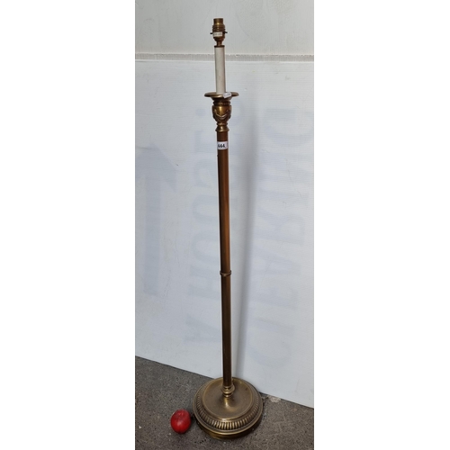 444 - An elegant floor standing cast metal lamp with a swag ornament to top and a round base. Just needs a... 