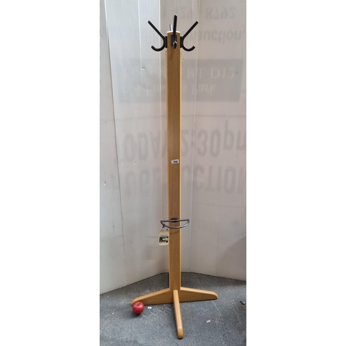 448 - A nicely proportioned floor standing coat rack with four hooks to top and an umbrella stand to base.... 