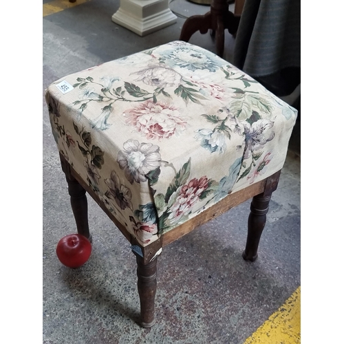 455 - A charming antique stool with turned wooden legs and a seat upholstered in a colourful floral fabric... 