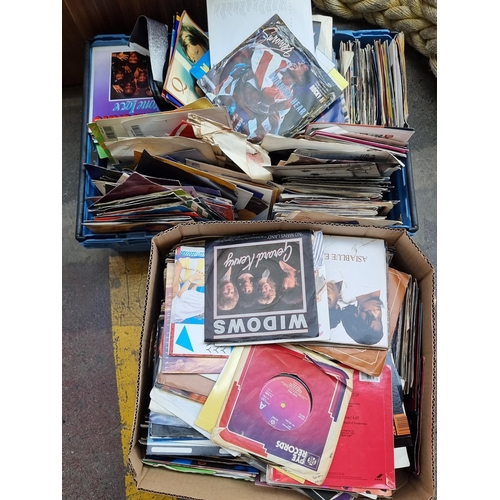 467 - Two boxes with a huge collection of approximately 300 vinyl singles from the 1970s/1980s mostly rock... 