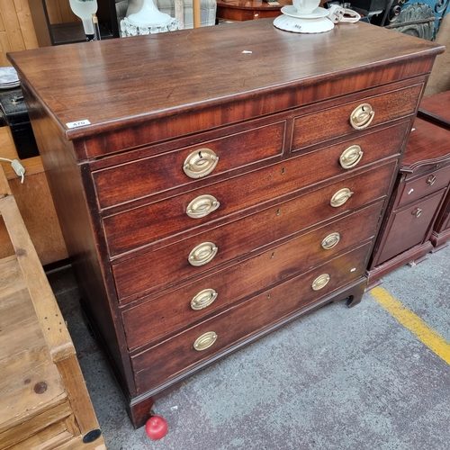 470 - Star lot : A handsome Georgian chest of six graduating drawers in a Campaign aesthetic. Featuring br... 