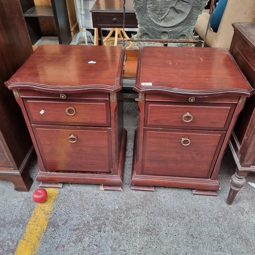 471 - A pair of serpentine fronted bedside lockers. Designed to accommodate a single cupboard, a drawer an... 