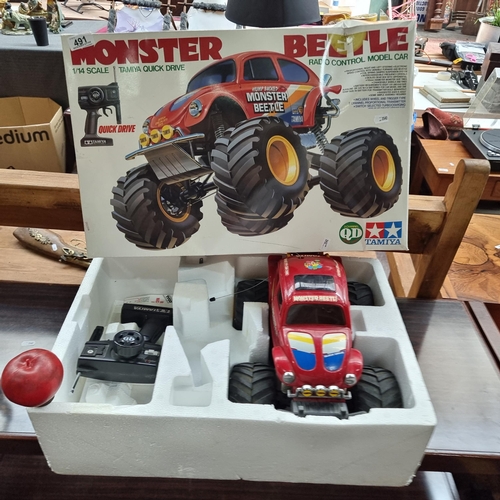 491 - A Tamiya branded remote control model car. This is a Hump Backed Monster Beetle series example in a ... 