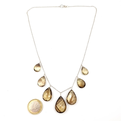 517 - A very pretty and generous facet cut tear drop Smokey Quartz necklace, featuring a sterling silver c... 