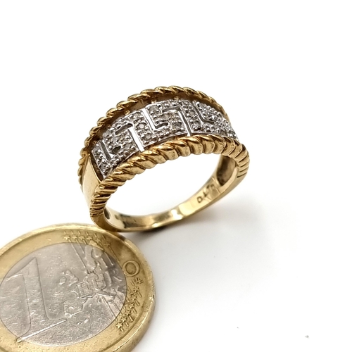 522 - Star Lot: A very attractive 9 carat gold Greek key inspired channel cut Diamond ring. Stamped 375. R... 