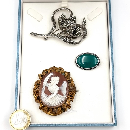 531 - A collection of three vintage brooches, comprising of a pinch back Cameo (5cm x 4.5cm), a Marcasite ... 