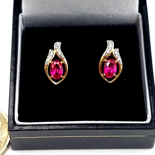 543 - A truly beautiful pair of 9 carat gold plated Ruby abstract inspired stud earrings, with White Sapph... 