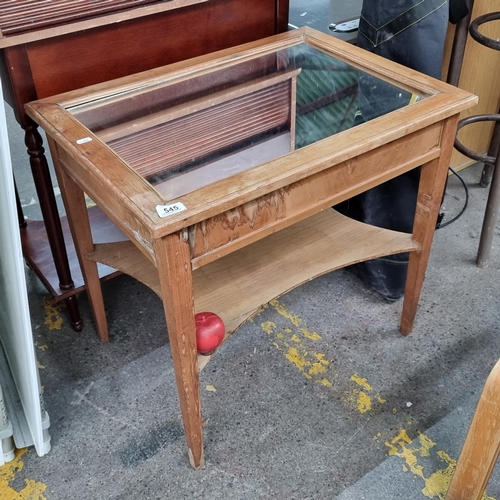 545 - An unusual vintage two tiered side table. A handsome example with a mirrored glass surface and carve... 