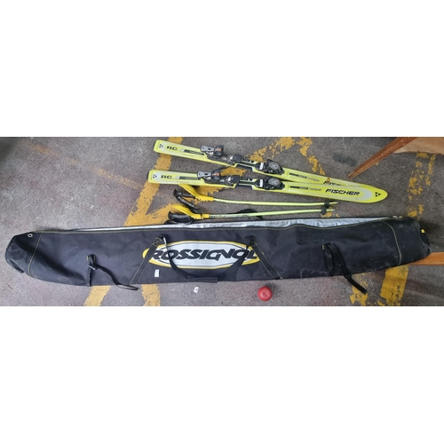 546 - A pair of Fischer Race Carve Skis (RC4) accompanied by 2 Fischer skiing poles, all housed in a Rossi... 