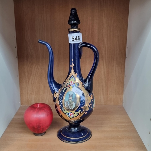 548 - A delightful hand-blown glass decanter boasting a hand-painted Turkish ornament including a portrait... 